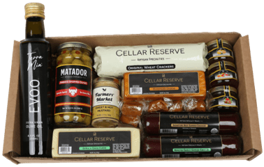 A box of cheese, meat and pickles.