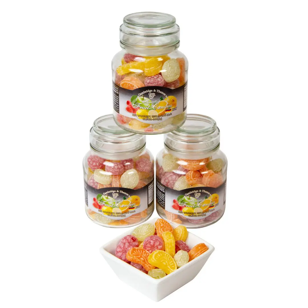 A group of three jars with candy inside.