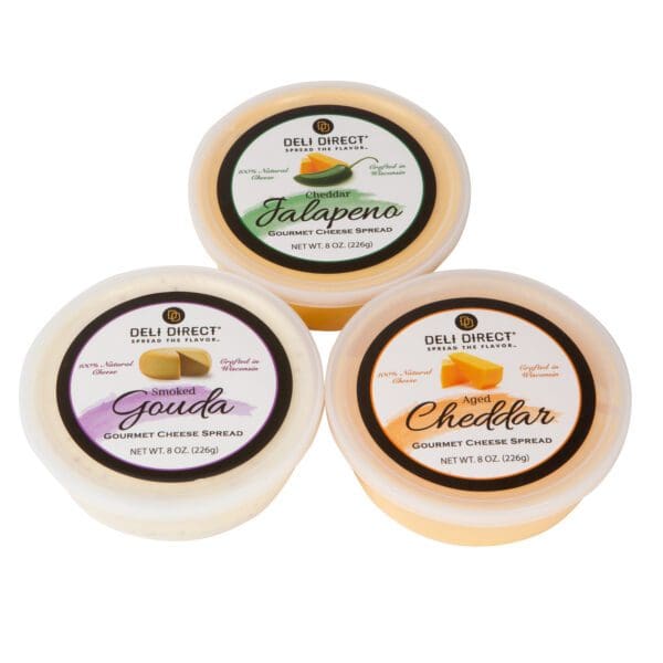Three different types of cheese are sitting side by side.