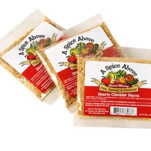 Three packages of a spice above 's savory chicken marinade.